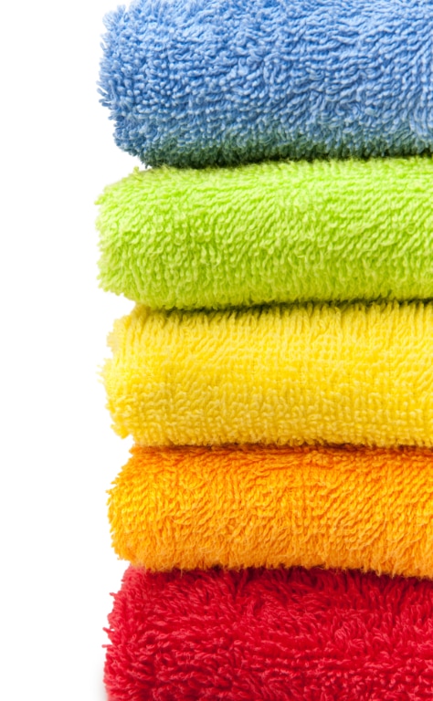 Soft, clean, colorful towels stacked.